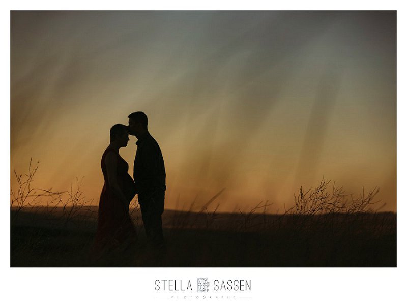 Pregnancy couple photo shoot at sunset silhouette