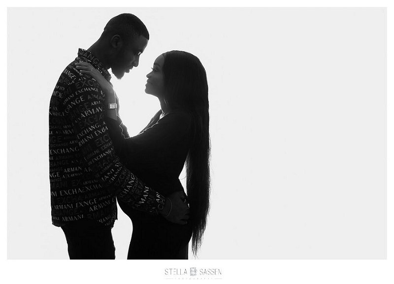 backlit couple maternity on white background