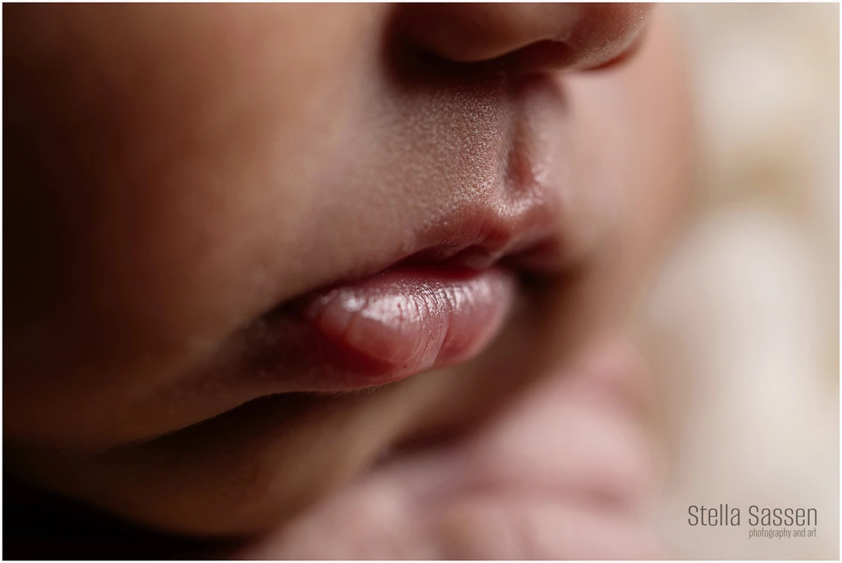 Close-up detail of a sleeping newborn's lips and nose, captured during a newborn photography session in Cape Town.